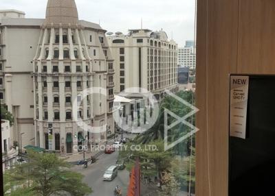 View from the building window overlooking the city intersection and architecture