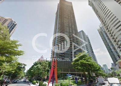 Modern high-rise residential building exterior with clear skies