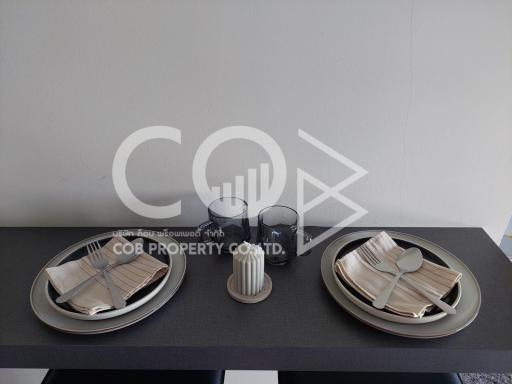 Modern dining table set with stylish dinnerware