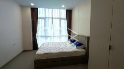 Modern bedroom with large bed and natural light