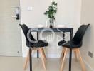 Modern dining area with table set for two