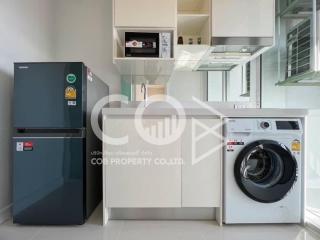 Modern kitchen with appliances and white cabinetry