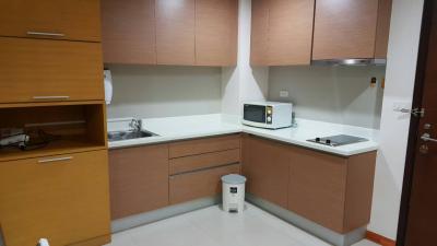 Modern kitchen interior with wooden cabinets and stainless steel appliances