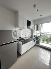 Modern kitchen with white cabinets and stainless steel appliances