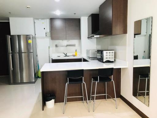 Modern kitchen with stainless steel appliances and a breakfast bar