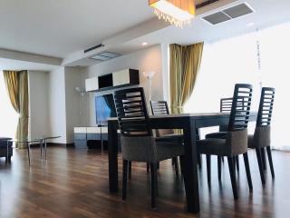 Spacious living room with dining area and modern decor