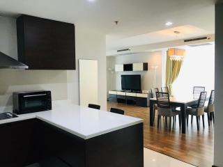 Modern living room with connected dining area and kitchen