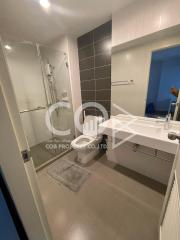 Modern bathroom with shower and white vanity