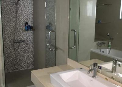 Modern bathroom interior with glass shower and basin