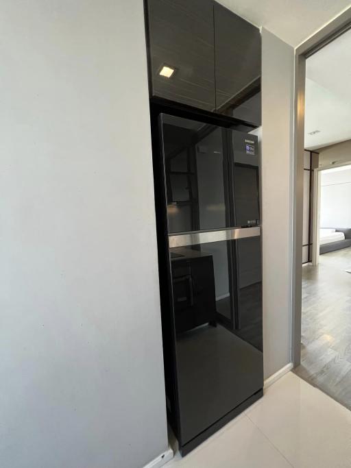 Modern interior design with sleek black kitchen appliance and clean lines