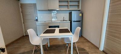 Modern kitchen with dining area in a compact living space