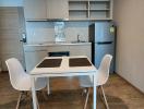 Modern kitchen with dining area in a compact living space