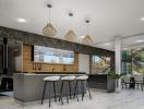 Modern kitchen with open plan design, bar stools and pendant lighting