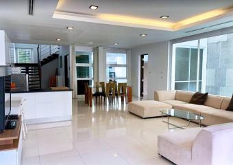 Spacious and modern living room with integrated dining area
