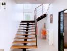 Elegant wooden staircase with white walls in a modern home