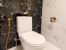 Modern bathroom with stylish marble walls and gold fixtures