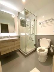 Modern bathroom with shower cubicle, toilet, and vanity