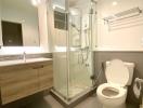 Modern bathroom with shower cubicle, toilet, and vanity