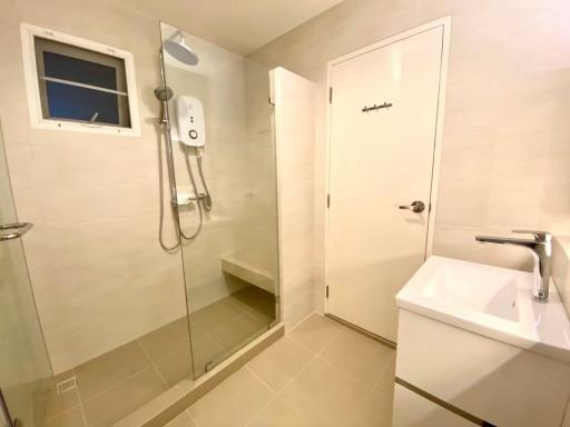 Modern bathroom with walk-in shower and beige tiles