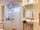 Modern bathroom with walk-in shower and white fixtures