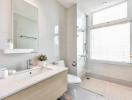 Modern Bathroom with White Fixtures and Natural Light