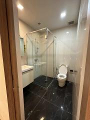 Modern bathroom interior with glass shower enclosure