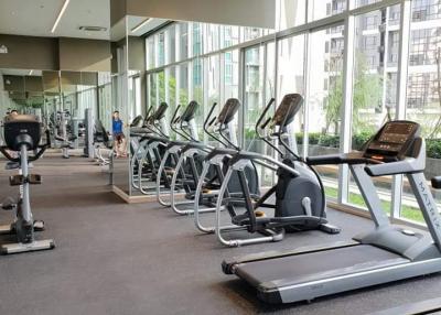 Modern gym facility within a residential building featuring various exercise equipment