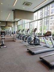 Modern gym facility within a residential building featuring various exercise equipment