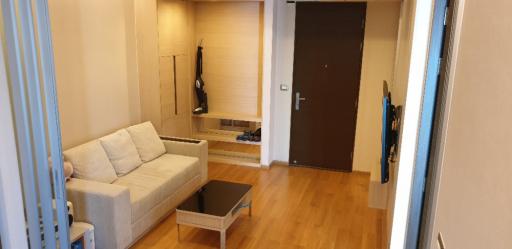 Cozy living room with beige walls and wooden floor