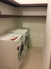 Laundry room with washing machine and dryer