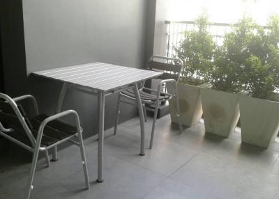 Modern balcony with chairs and table