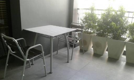 Modern balcony with chairs and table