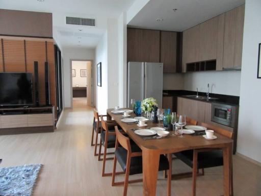 Modern open plan kitchen and dining area with wooden finish