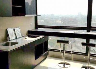 Modern kitchen with city view, high-rise apartment