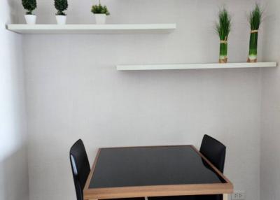 Modern dining area with wooden table and minimalist decor