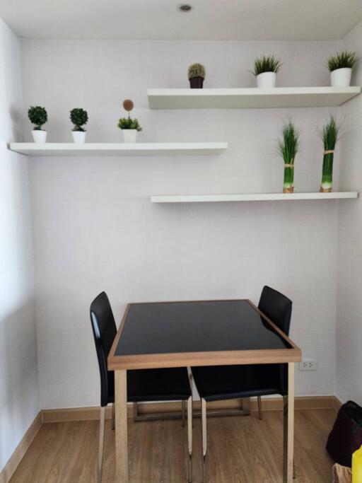 Modern dining area with wooden table and minimalist decor