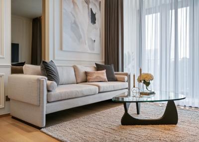 Elegant and modern living room with neutral tones and ample natural light