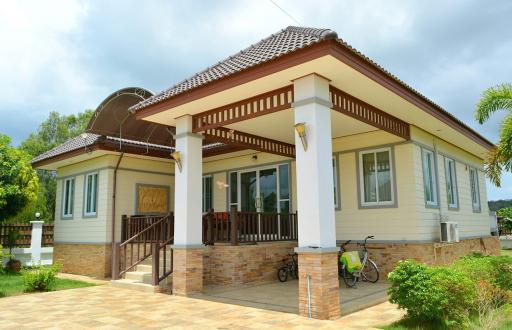 Single-story house with a tile roof and a front porch