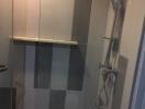 Modern tiled bathroom with shower and glass door
