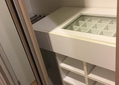 Modern built-in closet interior with shelves and drawers