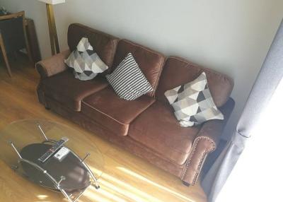 Cozy living room with a leather sofa and modern coffee table