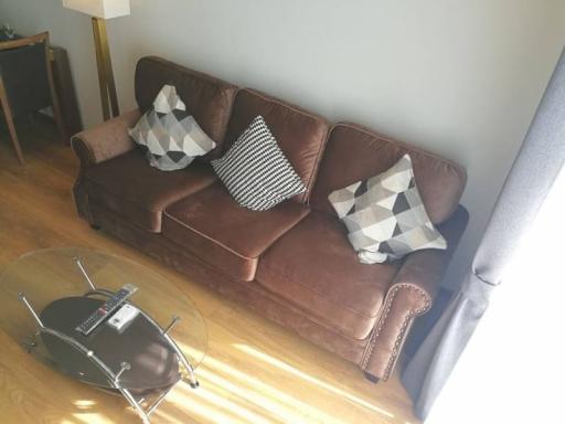 Cozy living room with a leather sofa and modern coffee table