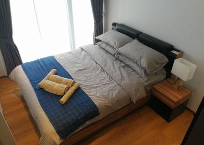 Cozy bedroom with a modern bed and stylish nightstand