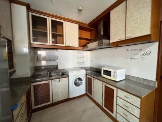 Modern kitchen with wooden cabinets and built-in appliances