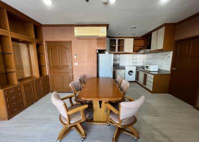 Spacious kitchen with modern appliances and large dining table