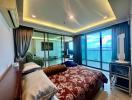 Spacious bedroom with large windows and ocean view