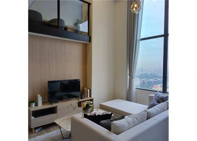 "Luxury Phra Khanong Condo: 2BR, City Views, Amenities"