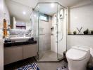 Modern bathroom interior with glass shower cubicle and vanity