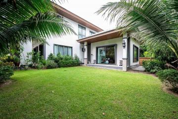 Spacious backyard with lush green lawn of a suburban house