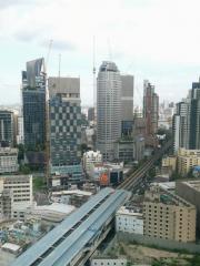 High-rise cityscape with skyscrapers and metro rail